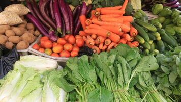 Beautifully arranged fresh vegetables at a javanese traditional market, for sale. photo