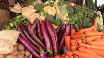 Beautifully arranged fresh vegetables at a javanese traditional market, for sale. photo