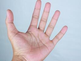 man's open palm isolated on white background photo