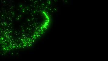 A magic beam of green color from luminous particles draws curls. Comet, magic, abstraction, fireworks. Background video