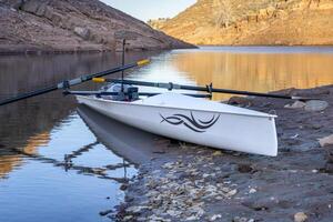 coastal sculling shell in sandstone canyon of Horsetooth Reservoir in Colorado in fall scenery photo