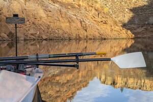 oars of coastal sculling shell in sandstone canyon of Horsetooth Reservoir in Colorado in fall scenery photo