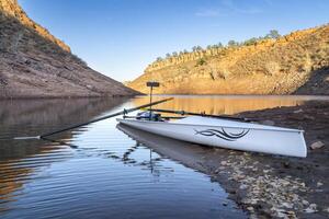 coastal sculling shell in sandstone canyon of Horsetooth Reservoir in Colorado in fall scenery photo