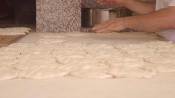 The process of preparing artisan bread dough in a traditional bakery setting video