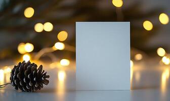A white card with a pine cone on top of it photo