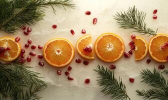 A row of oranges and pomegranates on a white background photo