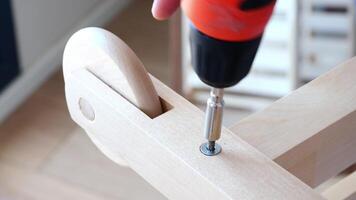 A CloseUp View of an Electric Screwdriver That Is Used in Various Wooden Assembly Projects video