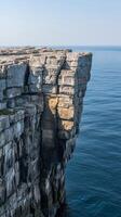 Rock platform extending from cliff base into the sea , wallpaper art photo