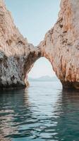 Arch spanning water between cliff sections , photorealistic photo