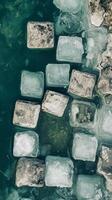 Floating ice blocks in lake formed by glacier meltwater , photorealistic wallpaper photo