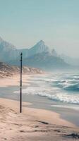 Dunes create wave-like formations with mountains in backdrop, wallpaper photo