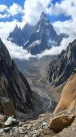 Peaks rise through cloud layers toward the sky in a mountain range, wallpaper art photo