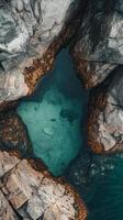 Tide pools between rocks along the shoreline, wallpaper art photo