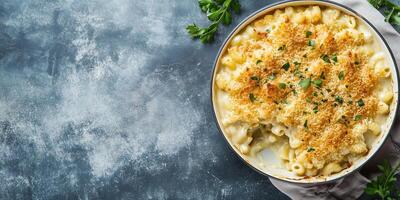 Mac and cheese dish on a flat surface with a portion served, meal photography photo