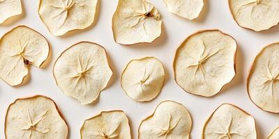 Handful of dried apple slices in a slightly irregular pattern, culinary photography photo