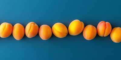Handful of apricots in a slightly curved line on a flat surface, culinary photography photo