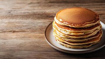 Neatly arranged stack of buttermilk pancakes on a round plate, photorealistic food photo