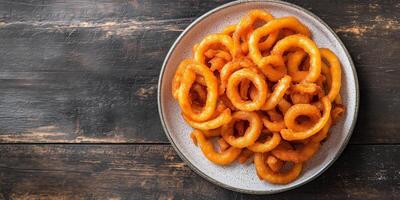 Small pile of curly fries neatly arranged on a plate, photorealistic food photo