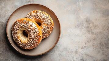 Round plate with a bagel cut in half, each side evenly spread, photorealistic food photo