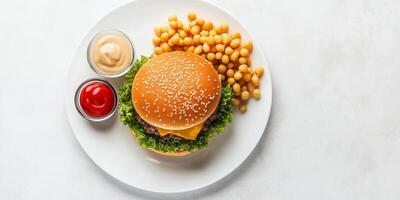 Cheeseburger centered on a plate, surrounded by small sides, food setting photo