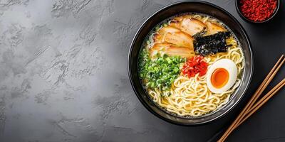 Ramen dish with noodles, broth, and toppings in a ceramic bowl with chopsticks, meal photography photo