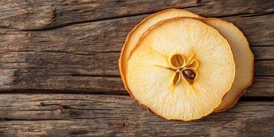 Single dried apple slice resting on another, meal photography photo