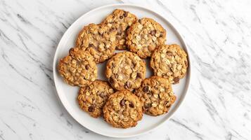 Oatmeal cookies arranged in a circular pattern on a plain white plate, food photography photo