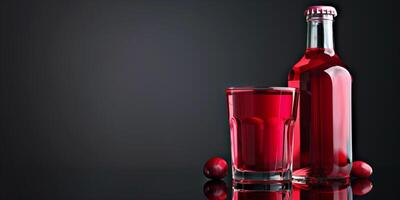 Transparent glass of cranberry-flavored cider, next to its bottle, placed on a reflective surface, food photography photo