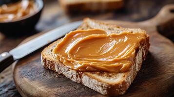 Dulce de leche spread on toast on a cutting board with a knife, photorealistic food photo