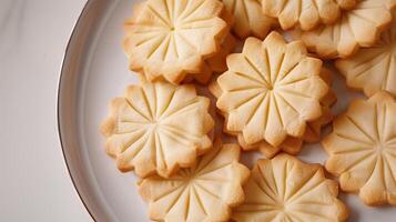 Shortbread cookies arranged in a circular pattern on a white plate, photorealistic food photo