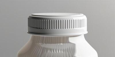 Close-up of sports drink bottle cap with sealed packaging against neutral background, food setting photo