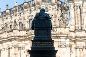Dresden, Germany-august 15, 2022-Walking in Schlossplatz and view the statue of Frederick Augustus I the Just in a sitting position in Dresden on a sunny day photo