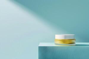 Minimalist Glass Jar with Gold Body Cream on Light Blue Table photo