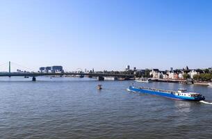 View at the Rhine in Cologne in Germany in fine weather with the famous buildings of the skyline in the background. photo