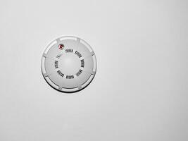 fire alarm sensor on white ceiling photo