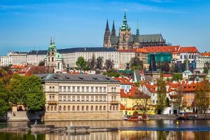 View of Charles bridge over Vltava river and Gradchany photo