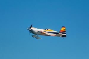 Stunt aerobatic plane performing stunts in air photo
