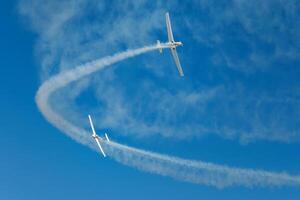 Stunt aerobatic planes performing stunts in air photo