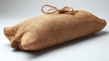 A beautifully crafted burlap sack displaying its rustic charm on a clean backdrop photo