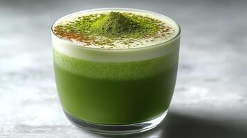 Enjoy a refreshing matcha latte with a smooth texture and a delightful spice topping photo