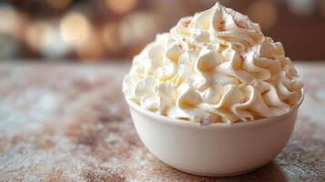 Indulging in a creamy bowl of whipped cream topped with a sprinkle of cinnamon in a cozy cafe setting during autumn photo