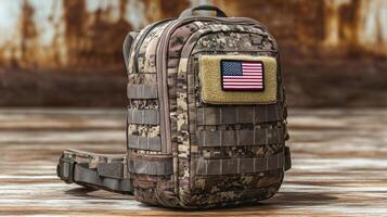 The tactical backpack displays camo patterns and proudly features an American flag patch photo