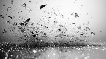 Shattered shards sparkle amidst a swirling dance of light and textures in black and white photo
