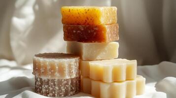 Beautifully arranged colorful soaps bask in warm light, showcasing artistic textures and hues photo