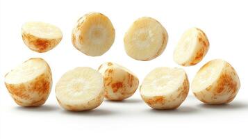 Creamy root vegetable slices scatter joyfully on the countertop, sparking culinary creativity photo