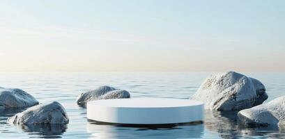 Minimalistic Blue Background with a White Marble Podium on Water surrounded by Rocks photo