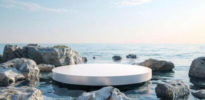 Minimalistic Blue Background with a White Marble Podium on Water surrounded by Rocks photo