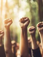 A vibrant crowd, fists raised high, gathers at a peaceful park protest, displaying their strength and community spirit, inspired by the significant cause they collectively represent photo