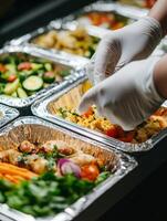 This image effectively showcases proper food handling practices by utilizing disposable gloves, which are crucial for ensuring hygiene and health safety during meal preparation and cooking processes photo
