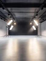 This is a spacious and completely empty photo studio that boasts modern lighting setups along with a sleek, minimalistic design, making it the ideal space for an array of diverse photography projects